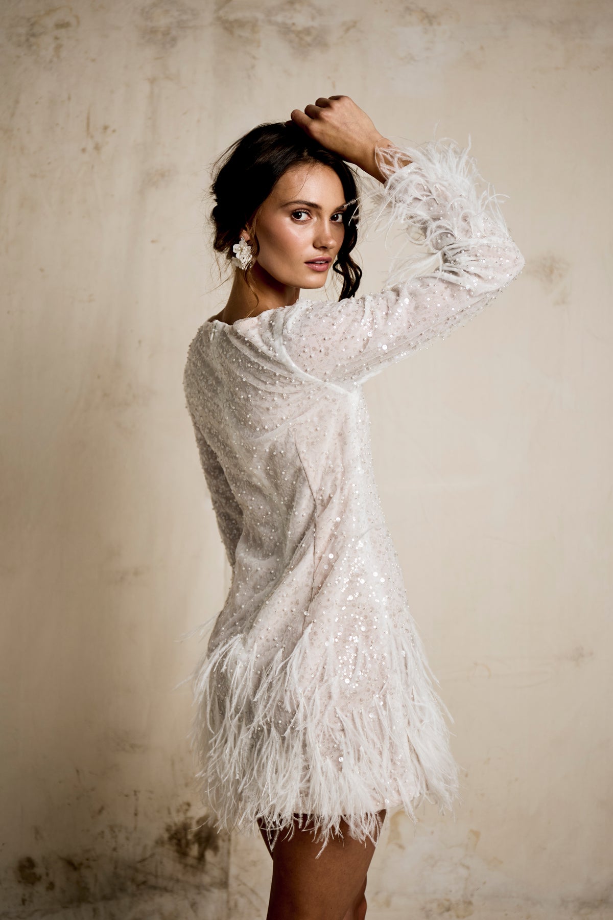 Modern high neck white sequin wedding after party dress with a textured feather hemline