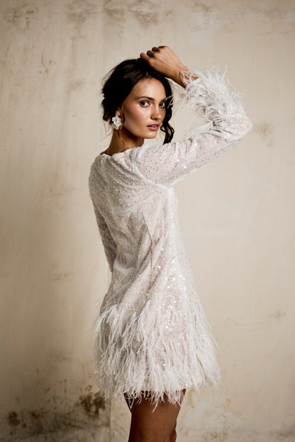 Modern high neck white sequin wedding after party dress with a textured feather hemline