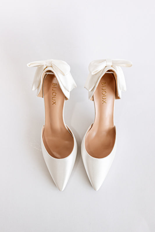 Classic bridal heels in white satin with bow detail at the back